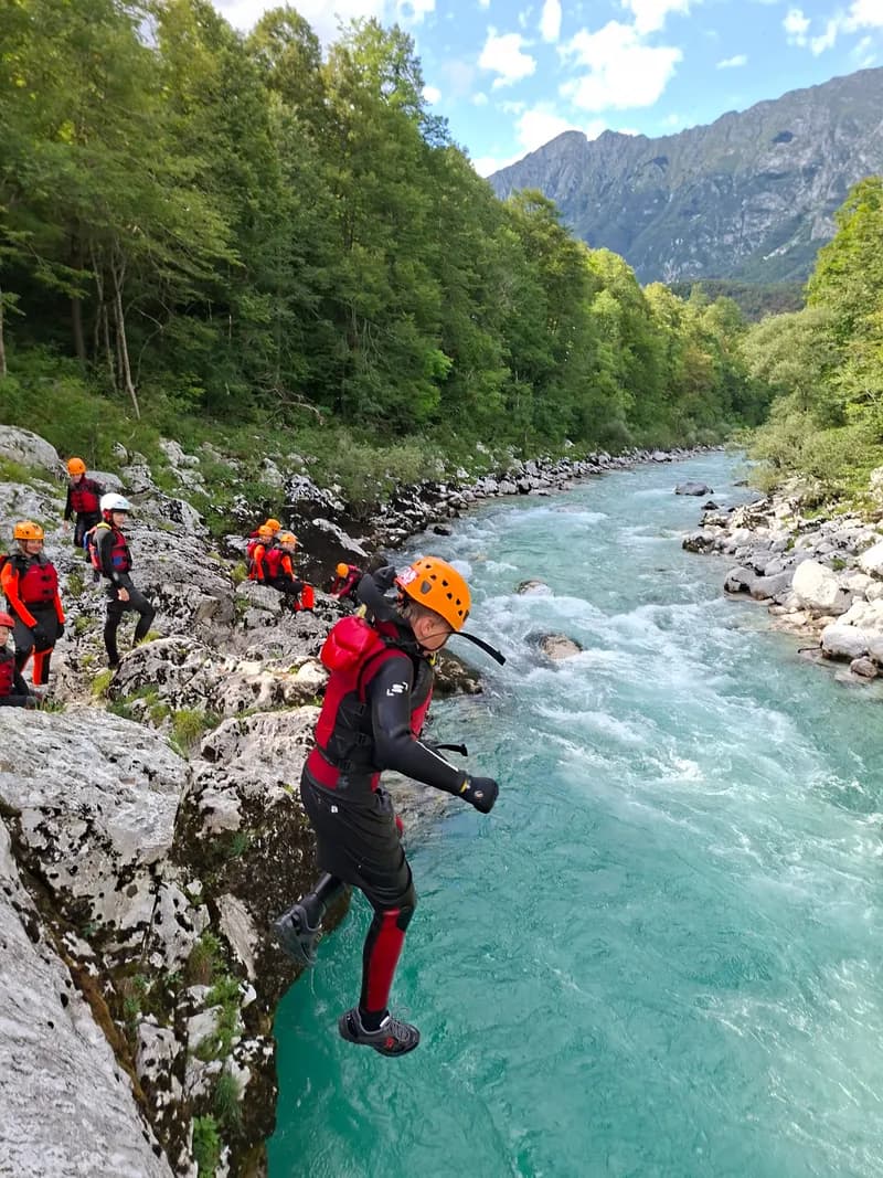 Jumping off rocks into the Soča River