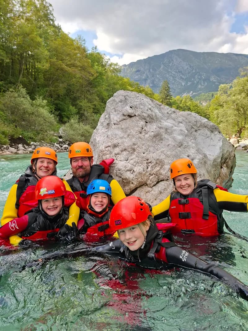 Family group photo in the Soča rapids