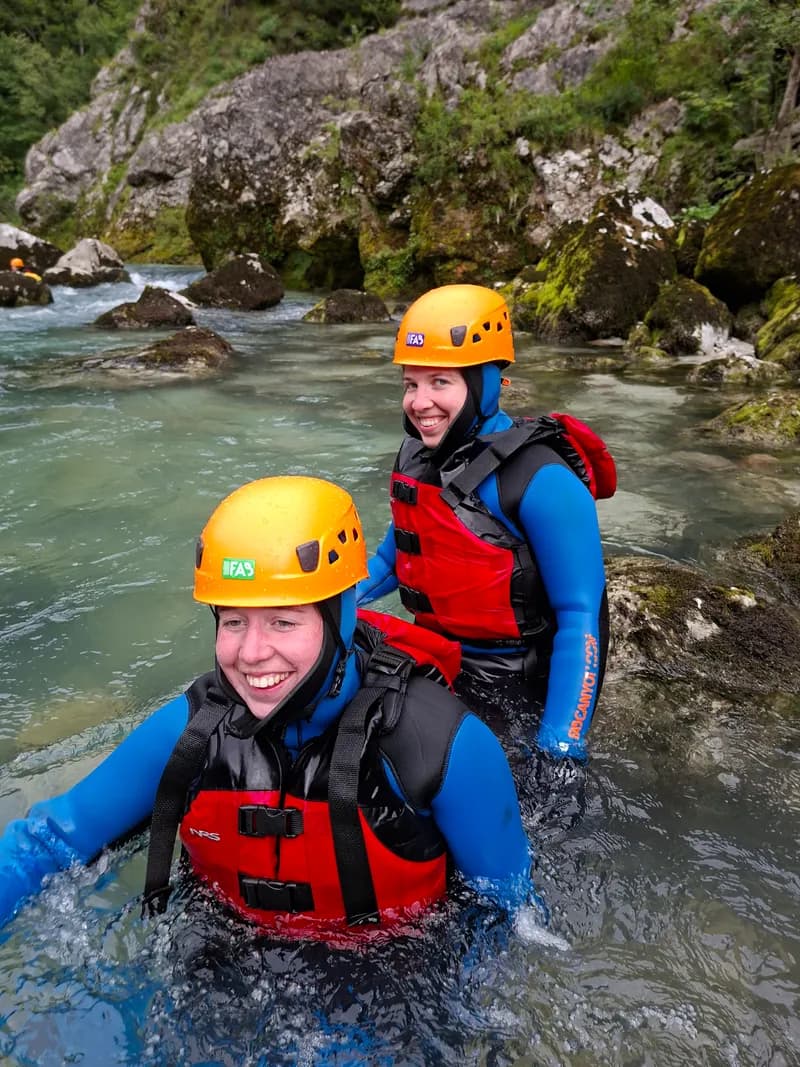 Two friends laughing in the rapids
